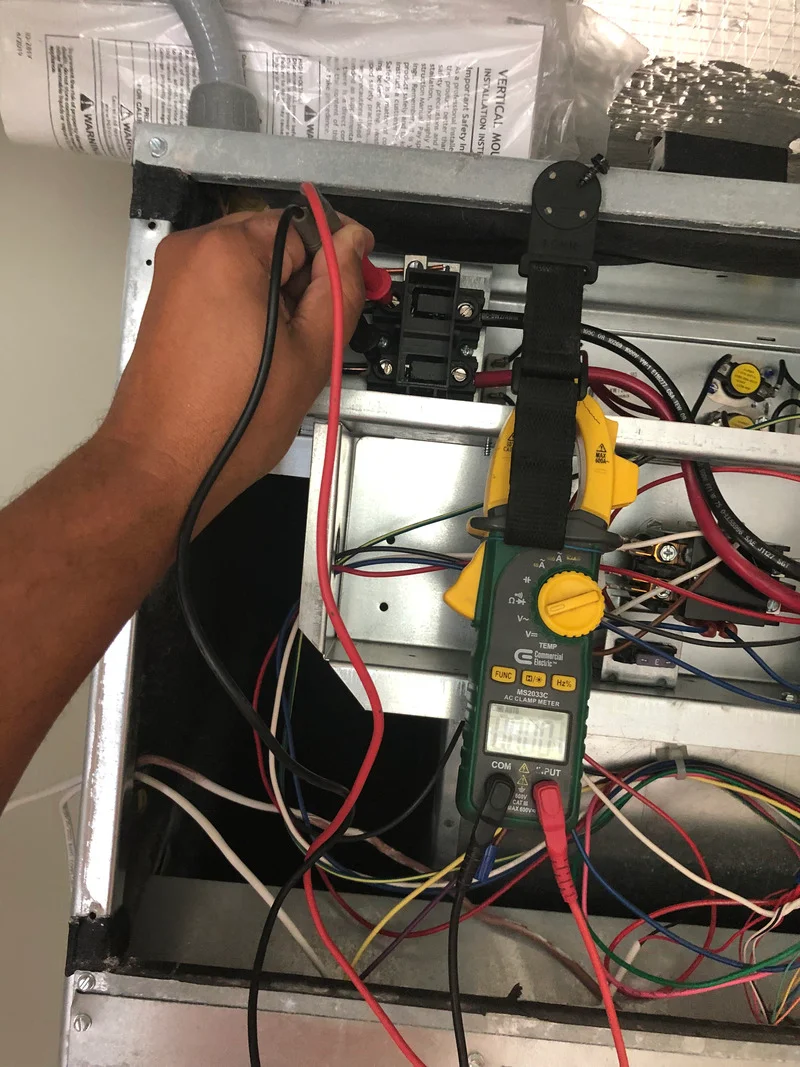 Heating expert in Myrtle Beach fixing a heating system.